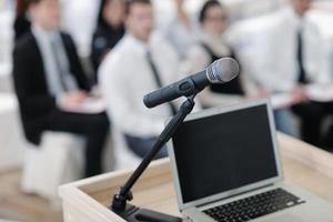 laptop on conference speech podium photo