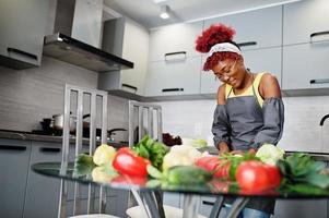 African american woman preparing healthy food at home kitchen. photo