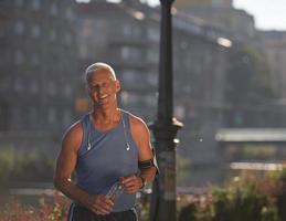 portrait of handsome senior jogging man photo