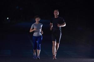 couple jogging at early morning photo