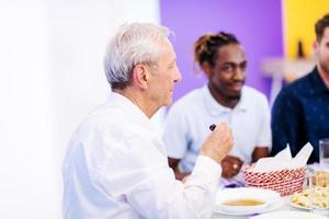 modern multiethnic muslim family sharing a bowl of dates photo