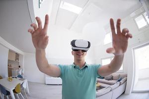 man using VR-headset glasses of virtual reality photo