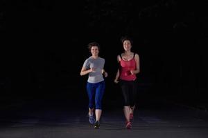 couple jogging at early morning photo