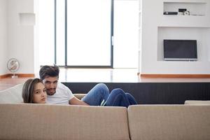 relaxed young couple at home staircase photo