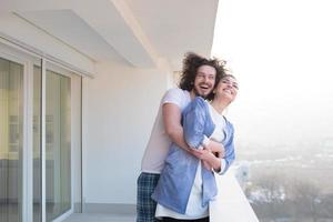 Couple hugging on the balcony photo