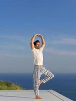 young man practicing yoga photo