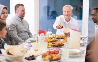 modern multiethnic muslim family having a Ramadan feast photo