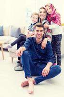 portrait of young happy modern muslim family photo