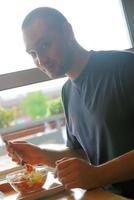 man eating healthy food it an restaurant photo