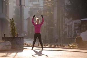 woman  stretching before morning jogging photo