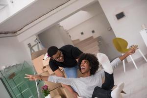 African American couple  playing with packing material photo