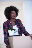 Black girl moving in the new apartment photo