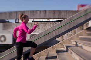 woman  stretching before morning jogging photo