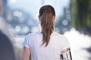 jogging woman setting phone before jogging photo