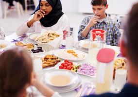 modern multiethnic muslim family having a Ramadan feast photo