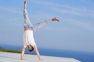 young man practicing yoga photo