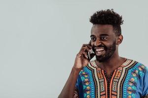 Native Sudan African male using smartphone isolated on white background. photo