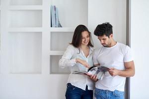 relaxed young couple at home staircase photo