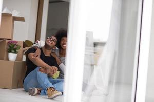 African American couple relaxing in new house photo