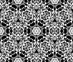 Floral white decorative pattern on a black background. Seamless vector pattern in the style of baroque. Lace pattern. Black and white color. For fabric, tile, wallpaper or packaging.