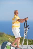 healthy senior man working out photo