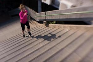 woman jogging on  steps photo