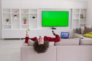 young man in bathrobe enjoying free time photo