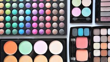 Collection of various cosmetic products. Make up eyeshadow palettes. photo