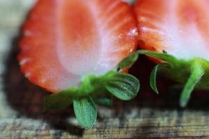 Fresh strawberry close up with slices photo