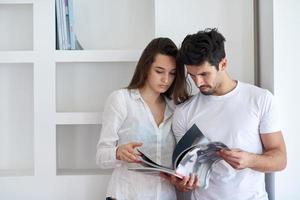 relaxed young couple at home staircase photo