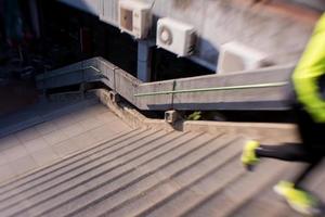 man jogging on steps photo