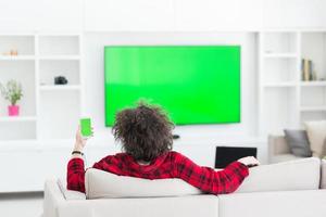 young man in bathrobe enjoying free time photo