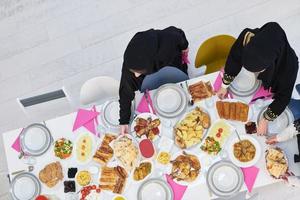 Top view of young muslim women preparing food for iftar during Ramadan photo