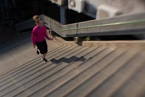 woman jogging on  steps photo