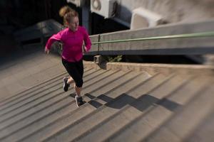 woman jogging on  steps photo