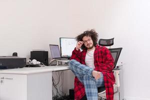 graphic designer in bathrobe working at home photo