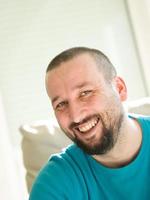 happy young  man  relaxing at home photo