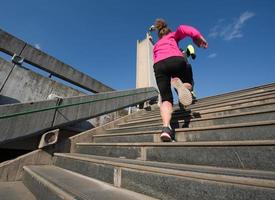 woman jogging on  steps photo