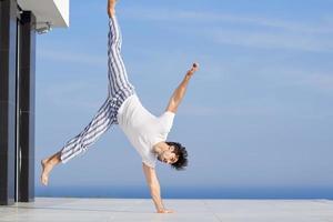 young man practicing yoga photo