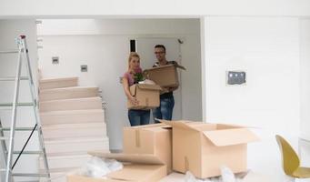 young couple moving into a new home photo