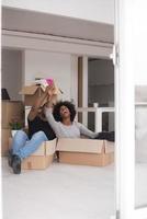 African American couple  playing with packing material photo