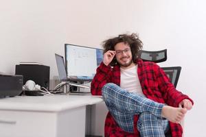 graphic designer in bathrobe working at home photo