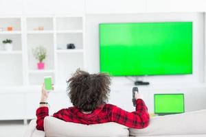 young man in bathrobe enjoying free time photo