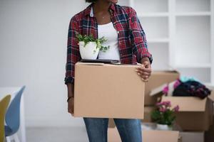 Black girl moving in the new apartment photo