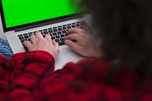 man freelancer in bathrobe working from home photo