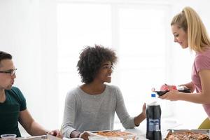 multiethnic group of young people have a lunch break photo