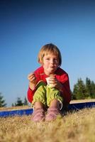 happy girl eating healthy food in nature photo