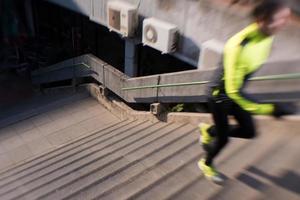 man jogging on steps photo