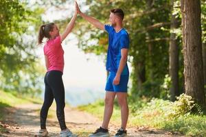 young couple preparing for a morning run photo