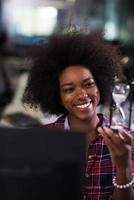 portrait of a young successful African-American woman in modern office photo